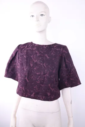 Access short purple top with ruffled mid length sleeves